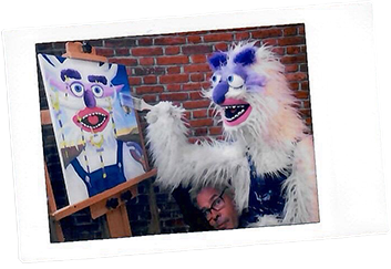Redd painting in the Surrealism episode of Learn to Paint Good